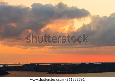 Panoramic view from hill of Bergen and fjord landscape red sky sunset scenery, Norway