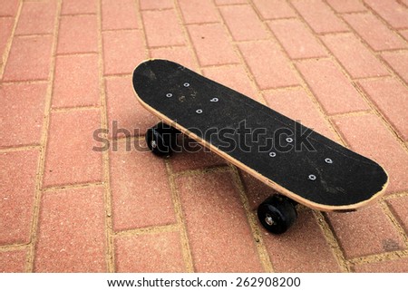 Sport equipment. Lone skateboard deck on concrete background