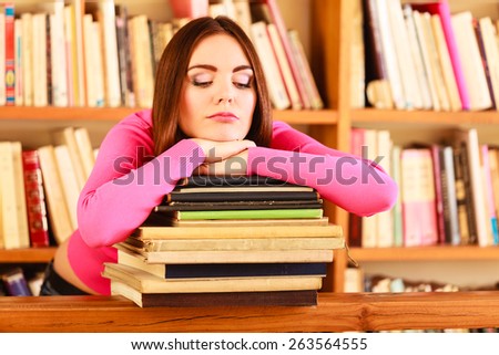 Education school concept. Tired female student fashion long hair girl in college library