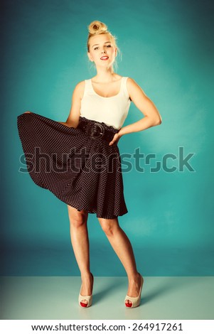 Retro pin up woman style. Beauty young full length girl in studio. Vintage photo.