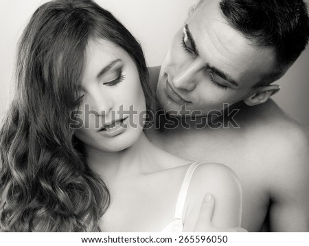 Temptation woman and man. Passionate young people in love. Couple in the passion. Black & white photo