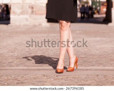 Street fashion. Urban lifestyle. Female legs in stylish elegant fashionable shoes boots outdoor