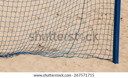 Football summer sport. closeup goal net on a sandy beach outdoor. active lifestyle