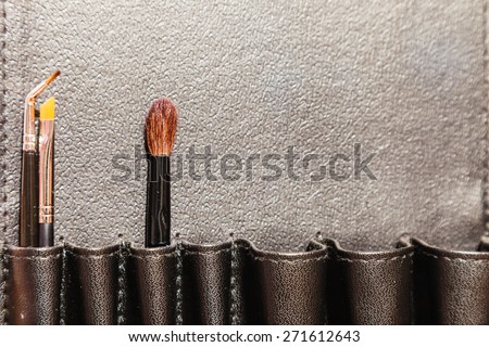 Beauty and makeup. Make up set brushes in black case background