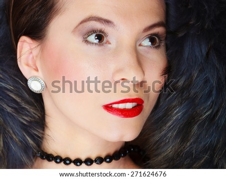 Fashion elegance and beauty. Woman in fur coat beautiful face makeup red lips, lady retro style portrait