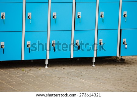 closeup blue deposite boxes with keys. left luggage checkroom background