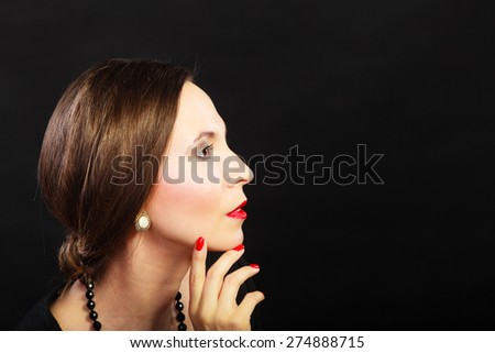 Fashion beauty and elegance concept. Woman retro style face profile. Elegant lady hair styling red lips on black