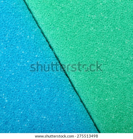 Blue green texture cellulose foam sponge background. Square format.