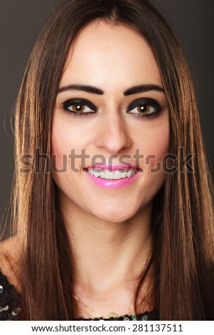 Closeup portrait smiling woman face, brunette long hair girl dark makeup