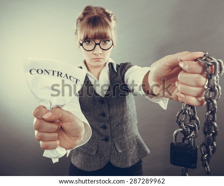 Businesswoman woman ending agreement deal. Young girl holding chain breaking free creasing squeezing paper. Termination, breach of contract. Instagram filtered.