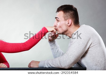 Polite man, husband kissing woman hand palm. Good, happy relationship. Love couple concept.