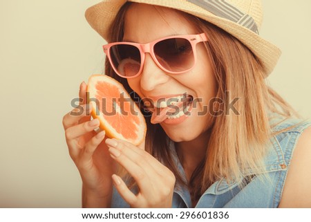 Happy glad woman tourist in straw hat drinking grapefruit juice. Healthy diet food. Weight loss. Summer vacation holidays. Instagram filtered.