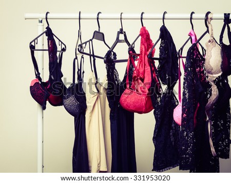 Shopping and fashion. Hanger with seductive sexy colorful lingerie underclothes. Shop interior.
