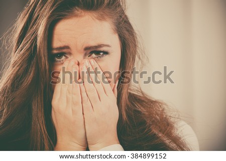 Sadness and emotional distress. Stressful situation in work trouble and anxiety. Young woman in white shirt cry.