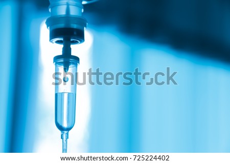 Set iv fluid intravenous drop saline drip hospital room,Medical Concept,treatment emergency and injection drug infusion care chemotherapy, concept.blue light background,selective focus