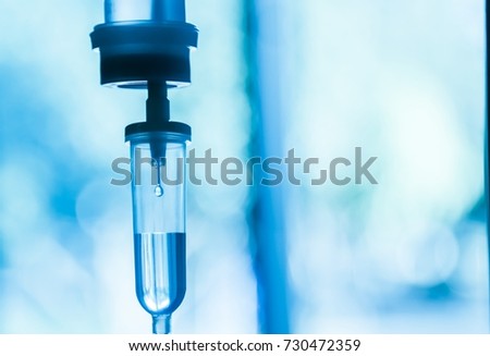 Set iv fluid intravenous drop saline drip hospital room,Medical Concept,treatment patient emergency and injection drug infusion care chemotherapy concept.blue light background hospital,Selective focus