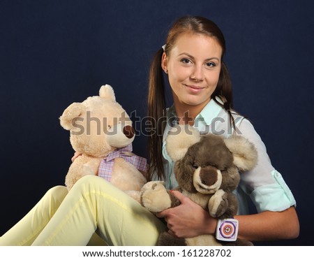 Young woman with teddy bears