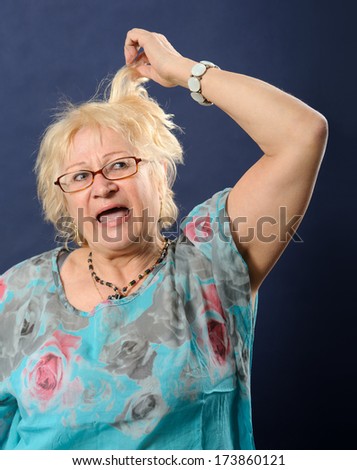 Woman screaming and pulling her hair.