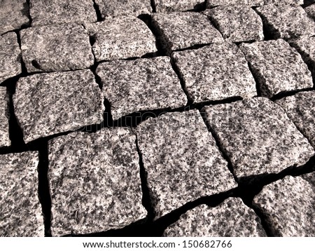 Square paving slabs of stone close-up