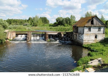The old water mill on the banks of the river