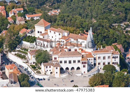 view of the palace in old town in Portugal in the woods with two kitchen chimneys
