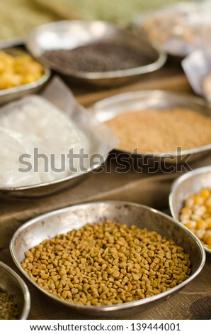 Spice Market bowls with herbs and spices for sale with shallow depth of field and focus on first bowl