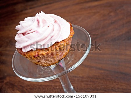 Mini sized pink raspberry cupcake. Home made and gluten free.
