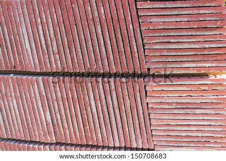 Red Concrete Paving Stone, construction material for a new sidewalk