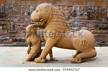 Sculpture of  lion and woman at Western temples of Khajuraho, Madhya Pradesh, India. Built around 1050, Khajuraho is UNESCO World heritage site.
