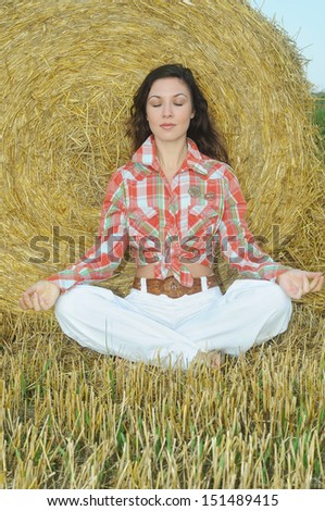 Young women have relaxation and balance with nature in the field at the sunrise