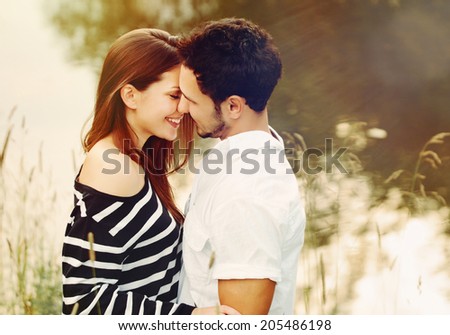 happy romantic sensual couple in love together outdoors on summer vacation