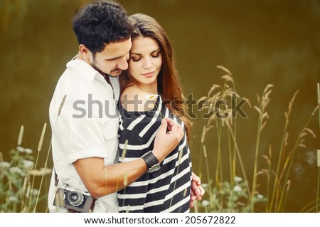 sensual romantic couple in love at the lake outdoor in summer day, beauty of nature, harmony concept