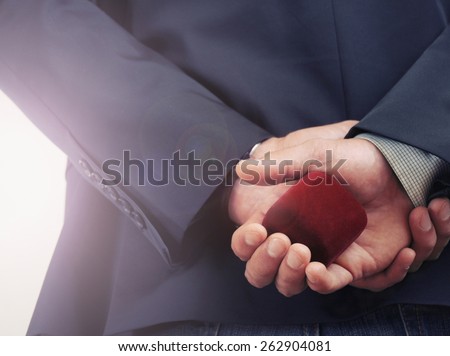 man making proposal with wedding ring and gift box, wedding concept, happy family