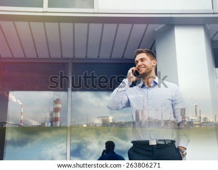double exposure of businessman with phone device and industrial enterprise on urban building background