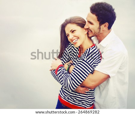 happy romantic wide smile couple in love at the lake outdoor on vacation, beauty of nature, harmony concept