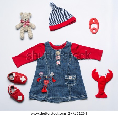 top view fashion trendy look of baby girl clothes and toy stuff, baby fashion concept