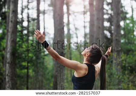 healthy lifestyle fitness sporty woman running early in the morning in forest area, healthy lifestyle concept