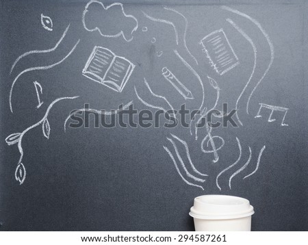 cup of coffee with drawing steam on the blackboard from the top view, happy morning concept