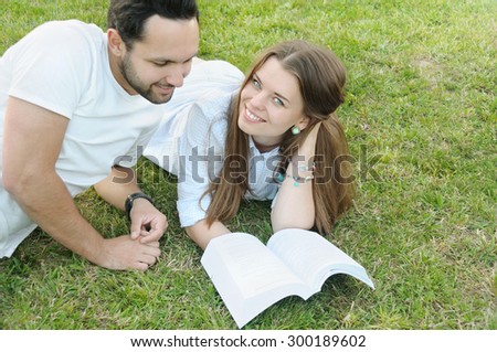 couple of young students studing in the park by the campus, lifestyle concept