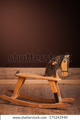 Wooden rocking horse hand colored by children.