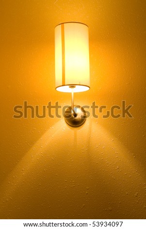 Lamp on a wall shining. Including copy space.