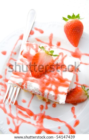 Delicious strawberry cream cake with fresh strawberries and decoration.