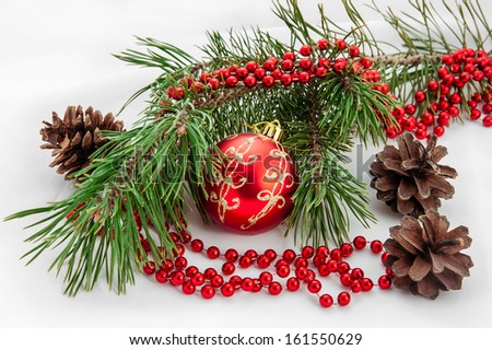 Bright christmas composition with red ball and fir tree on white background