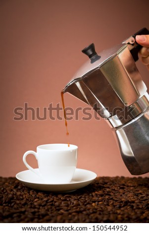 pouring coffee from the coffee maker