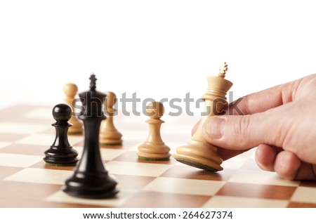 Playing chess - hand moving white king