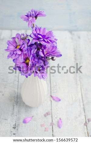 Bouquet of purple chrysanthemums in the white vase