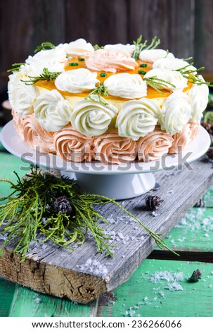 Christmas cake with a Christmas decoration on the wooden background