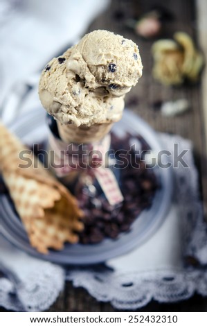 Coffee ice cream with chocolate drops in wafer roll
