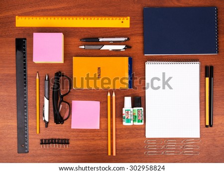 Office desk with glasses pen pencil ruler and other office items