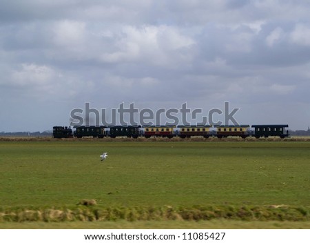 A passenger train powered by a steam locomotive